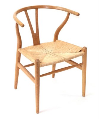 Lot 744 - Hans Wegner (Danish, 1914-2007) for Carl Hansen: A 1970's CH24 Wishbone Chair, weaved cord...