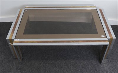 Lot 748 - A 1970's Chrome Metal and Brass Coffee Table, with plate glass top and square form metal frame...