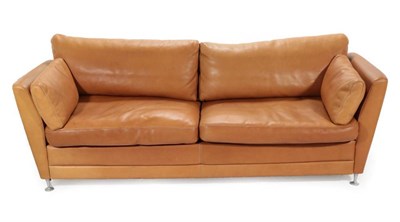 Lot 753 - A 1970's Danish Stouby Three-Seater Sofa, upholstered in natural tan leather, eight cushions, 215cm