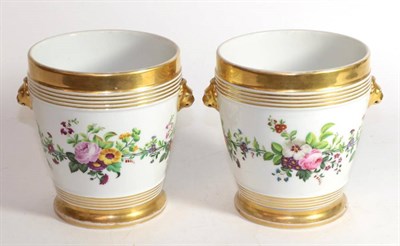 Lot 12 - A pair of continental porcelain twin handled floral painted jardinieres on stands