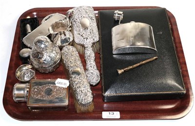 Lot 13 - A group of silver items to include a hip flask; George II style cream jug; scent bottle etc;...