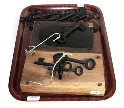 Lot 43 - Two large locks in wood block mounts, with working keys; together with an assortment of other keys