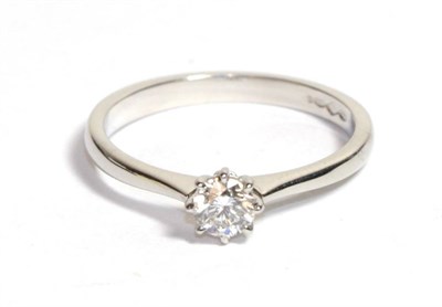 Lot 80 - A platinum diamond solitaire ring, a round brilliant cut diamond in a claw setting, to knife...