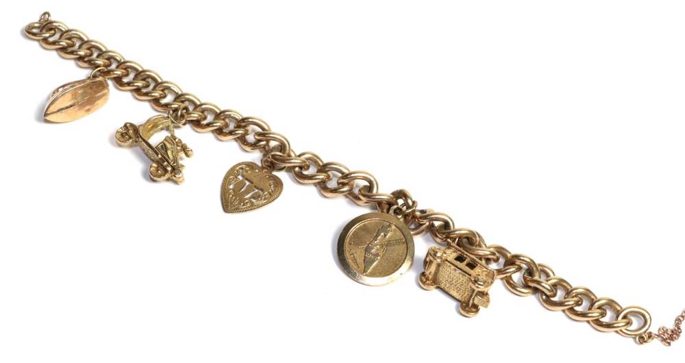 Lot 91 - A curblink charm bracelet stamped '3' '.375', hung with five charms and heart shaped lock (a.f.)