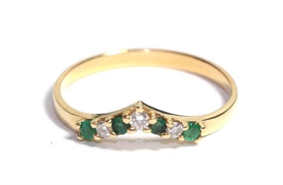Lot 110 - An emerald and diamond wishbone ring, finger size S1/2