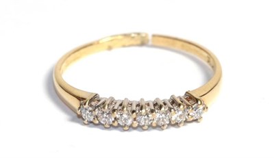 Lot 113 - An 18 carat gold diamond half hoop ring (a.f. band cut)