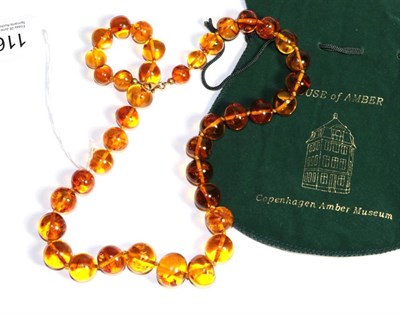 Lot 116 - An amber bead necklace, from House of Amber, Copenhagen, in original box, length 59cm