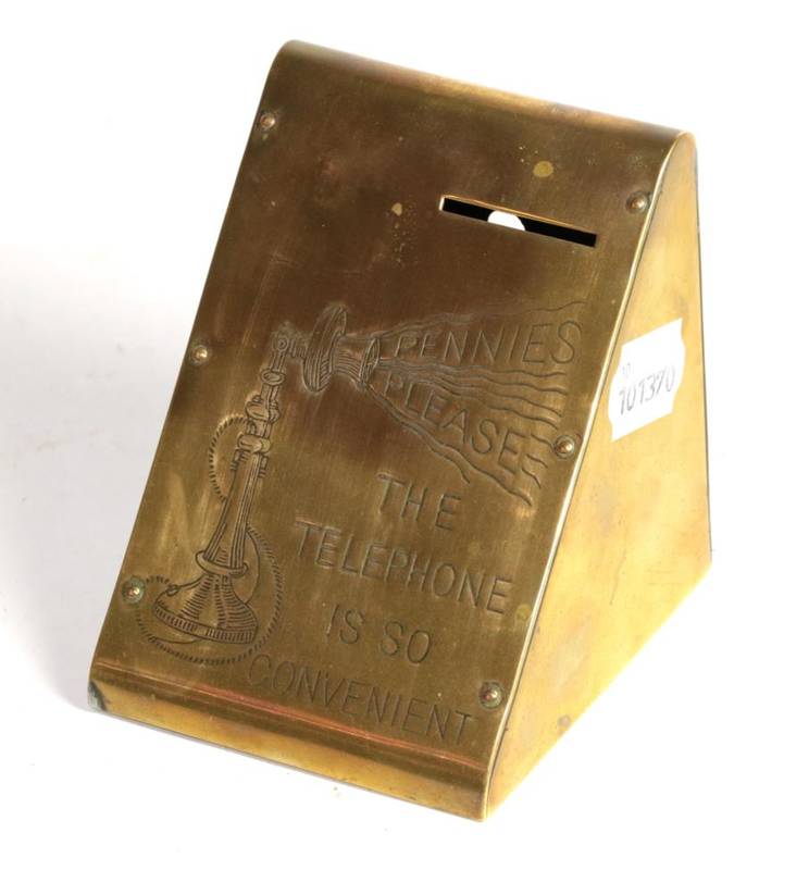 Lot 137 - Brass money box ''The telephone is convenient''