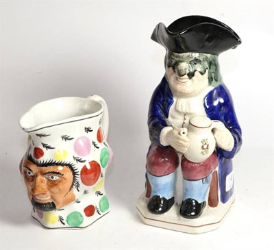 Lot 141 - A 19th century Toby jug together with another 19th century jug (2)