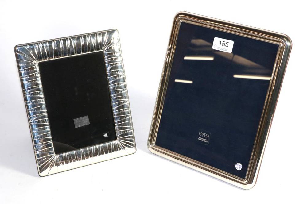 Lot 155 - A large modern rectangular silver photograph frame; and another unmarked frame with wide...