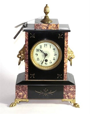 Lot 160 - A slate and marble gilt metal mounted French mantel clock with ring and lion mask handles
