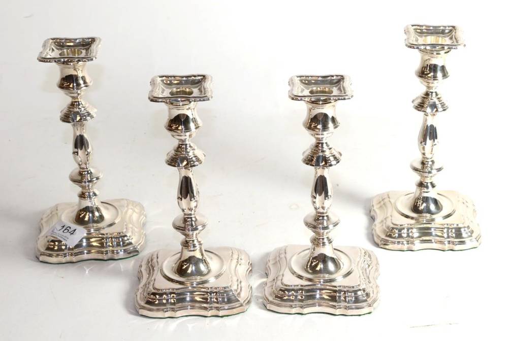 Lot 164 - A set of four of silver candlesticks of 18th Century style, C J Vander, Sheffield 2000/03, with...