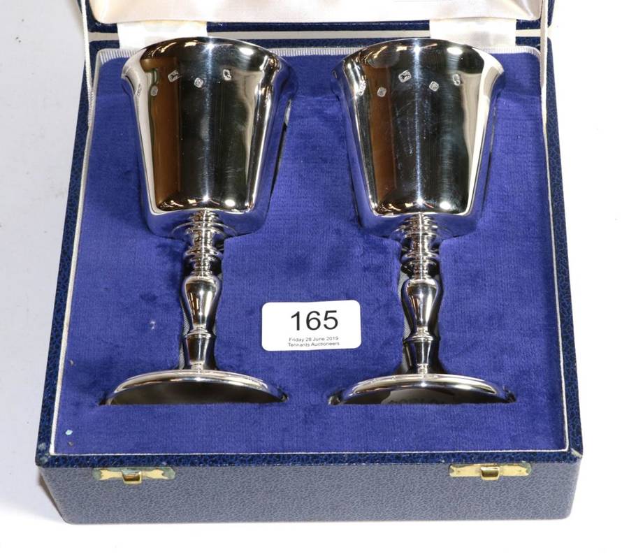 Lot 165 - A pair of silver wine goblets, Camelot Silverware, Sheffield 1977, in a fitted case, 14cm high,...