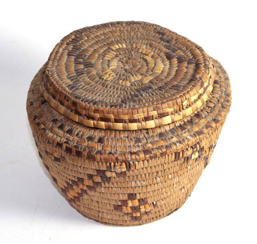 Lot 168 - An early 20th century North American Indian coiled ash splint basket and cover, Thompson Indian...