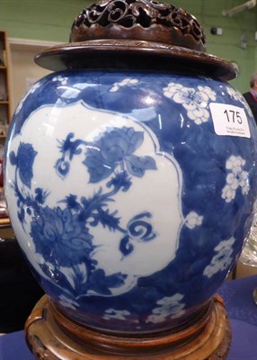 Lot 175 - An 18th/19th century Chinese blue and white porcelain ginger jar with pierced wooden cover and...