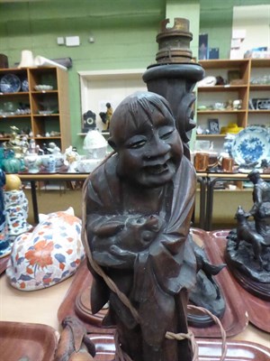 Lot 185 - A collection of Chinese root wood figures, two converted to lamp bases (two trays and a box)