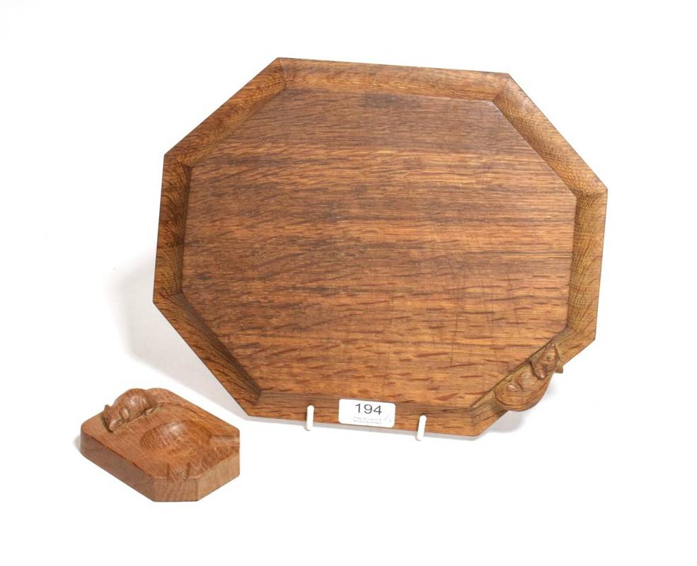 Lot 194 - A Robert Mouseman Thompson oak breadboard and ashtray (2)