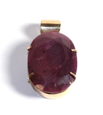 Lot 199 - A 9 carat gold pendant set with a red corundum, thought to be heavily treated (i.e. filled)