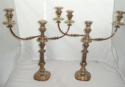 Lot 1026 - A Pair of Victorian Sheffield Plate Candelabra, late 19th century, the shaped cushion bases...