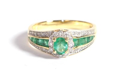 Lot 205 - An emerald and diamond dress ring, finger size O