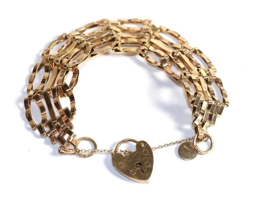 Lot 209 - A 9 carat gold gatelink bracelet with padlock clasp, length 16.5 cm