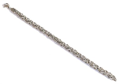 Lot 215 - A platinum fancy link bracelet, length 19cm