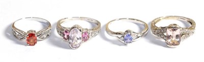 Lot 236 - Four 14 carat white gold gem set rings including a tanzanite and diamond example etc, various...