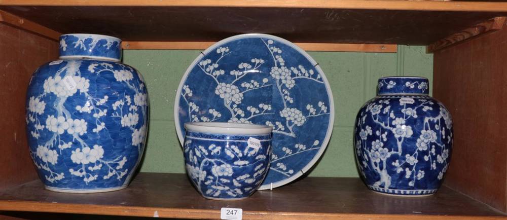 Lot 247 - Two large 20th century Chinese blue and white prunus ginger jars and covers, together with a...
