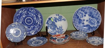 Lot 250 - A group of decorative Oriental blue and white and Imari chargers, plates and dishes (10)
