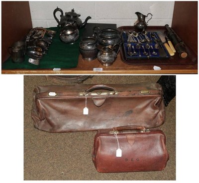 Lot 279 - Two Gladstone bags; Victorian porcelain pugs; Wade whisky bells etc