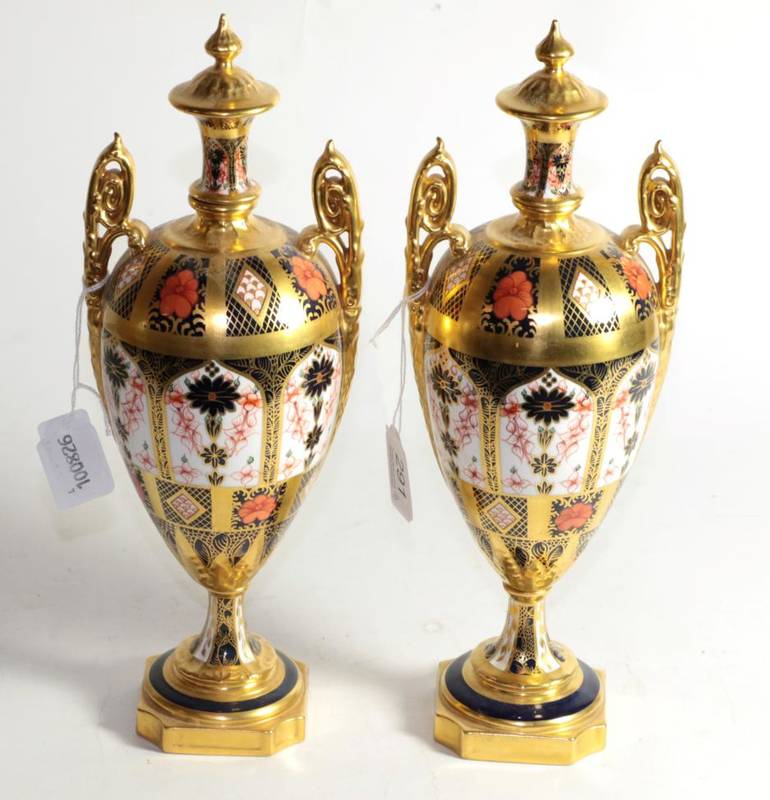 Lot 291 - A pair of Royal Crown Derby twin-handled vases, with integral stoppers, 31cm height (2)