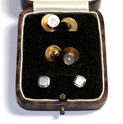 Lot 318 - Two dress studs, stamped '9CT'; a dress stud, stamped '18CT'; another dress stud stamped '9CT'; and