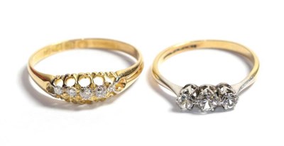 Lot 323 - An 18 carat gold five stone diamond ring, finger size Q1/2; and another paste set ring stamped...