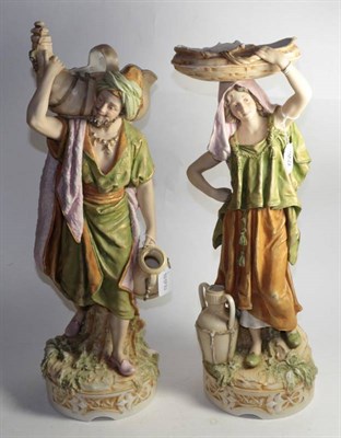 Lot 352 - A pair of Royal Dux figurines, basket and water carriers, marked to bases, 49.5cm and 47cm high (2)