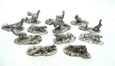 Lot 1054 - A Set of Twelve Menu Holders, 20th century, each modelled as a game bird, animal or hound, 5cm long