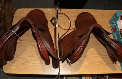 Lot 1131 - Springtree 17'' jumping saddle; Swaine Adenery 16'' G.P saddle; hunting whip; and two riding crops