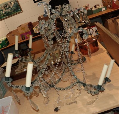 Lot 1141 - A 20th century eight arm chandelier with crystal drops