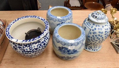 Lot 1159 - A pair of Chinese blue and white planters decorated with landscapes, a blue and white prunus...