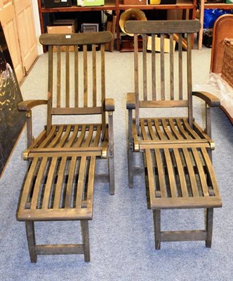 Lot 1176 - Two Prestige teak lounge chairs