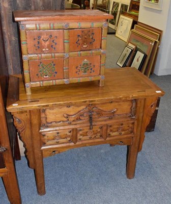 Lot 1179 - Chinese elm side table with single drawer and carved spandrels; and a small painted cabinet (2)
