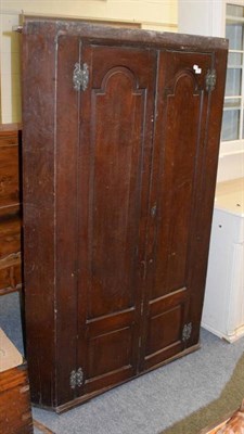 Lot 1181 - A Georgian oak corner cupboard