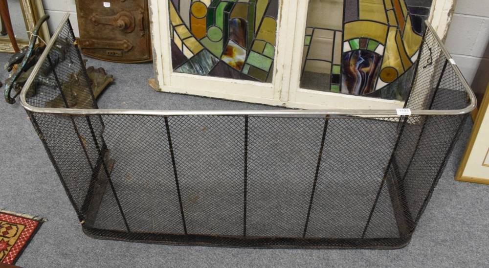 Lot 1193 - A 19th century polished steel and wirework fire guard