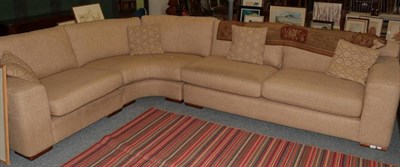 Lot 1216 - A corner sofa upholstered in oatmeal fabric