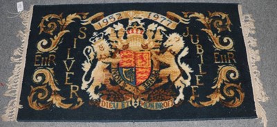 Lot 1222 - A machine made Queen Elizabeth II silver jubilee rug, 136cm by 79cm