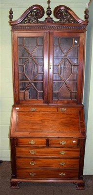 Lot 1235 - A modern mahogany bureau bookcase, with glazed astragal doors and fitted interior