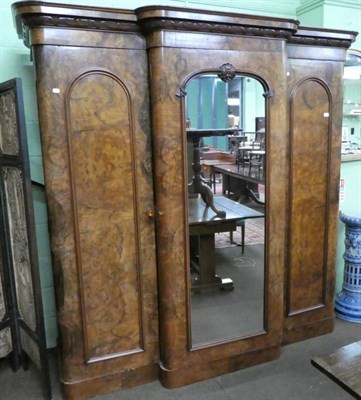 Lot 1249 - A Victorian burr walnut breakfront wardrobe, with central mirrored door