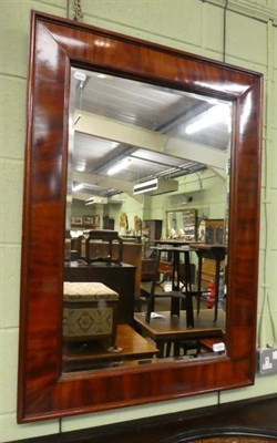 Lot 1255 - A 19th century flame mahogany bevel glass mirror, 105cm by 75cm