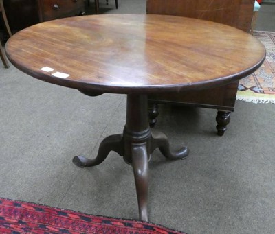 Lot 1265 - A George III mahogany tripod flip-top table, circa 1780