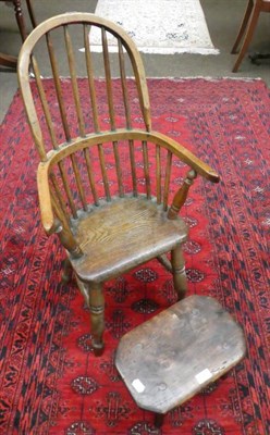 Lot 1267 - An oak and elm child's hoop back Windsor armchair; together with a 19th century oak foot stool (2)