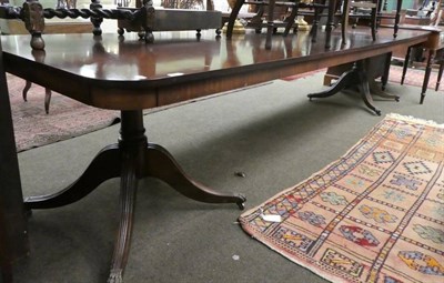 Lot 1273 - Large early 20th century mahogany pedestal dining table with three additional leaves, 351cm...